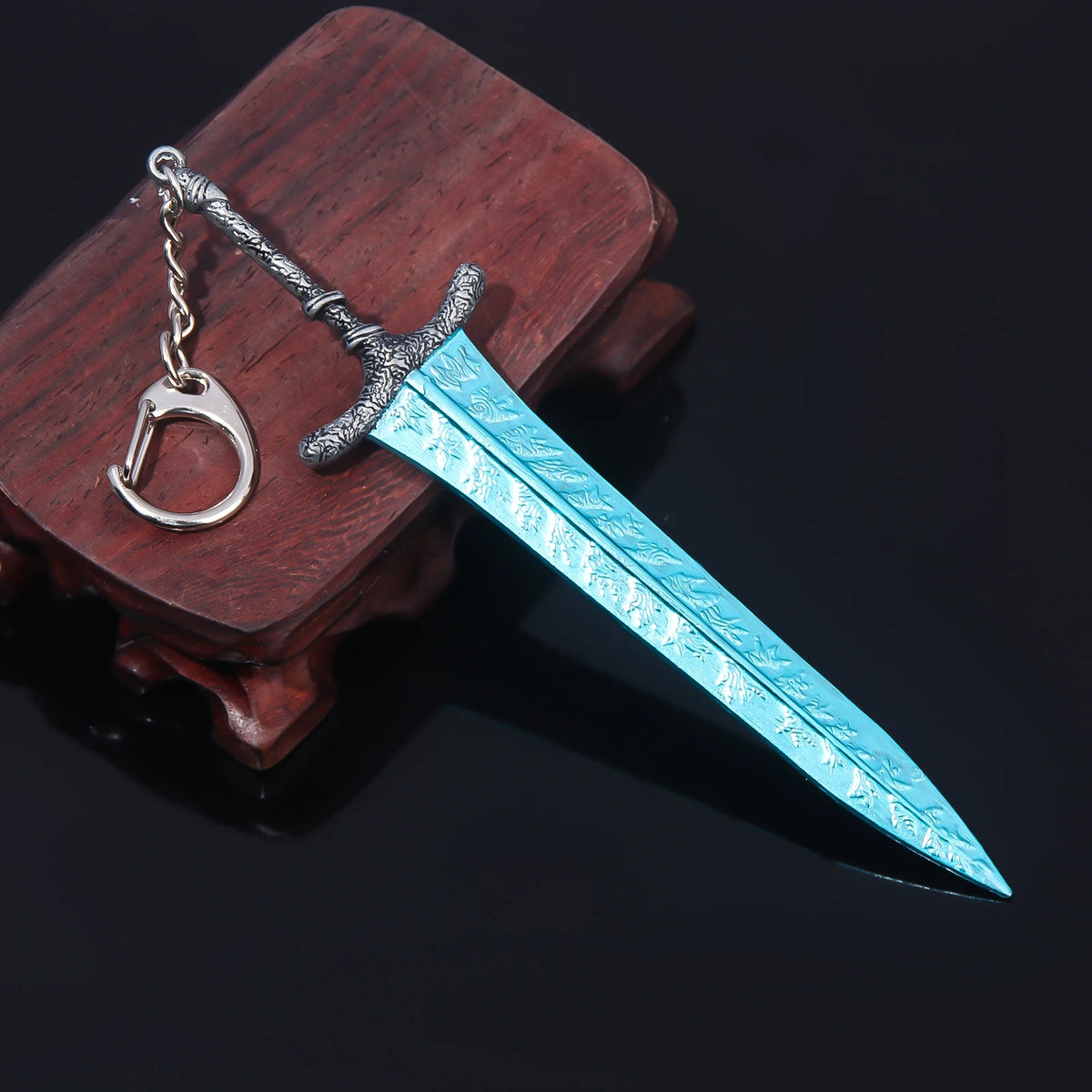 A silver-hilted katana sword with a blue blade is displayed on a dark wooden block.