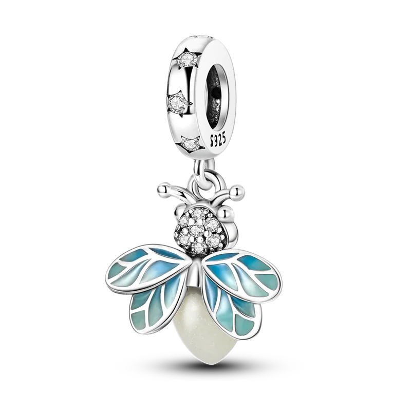 Sterling silver charm bracelet featuring a dragonfly pendant with blue and white iridescent wings