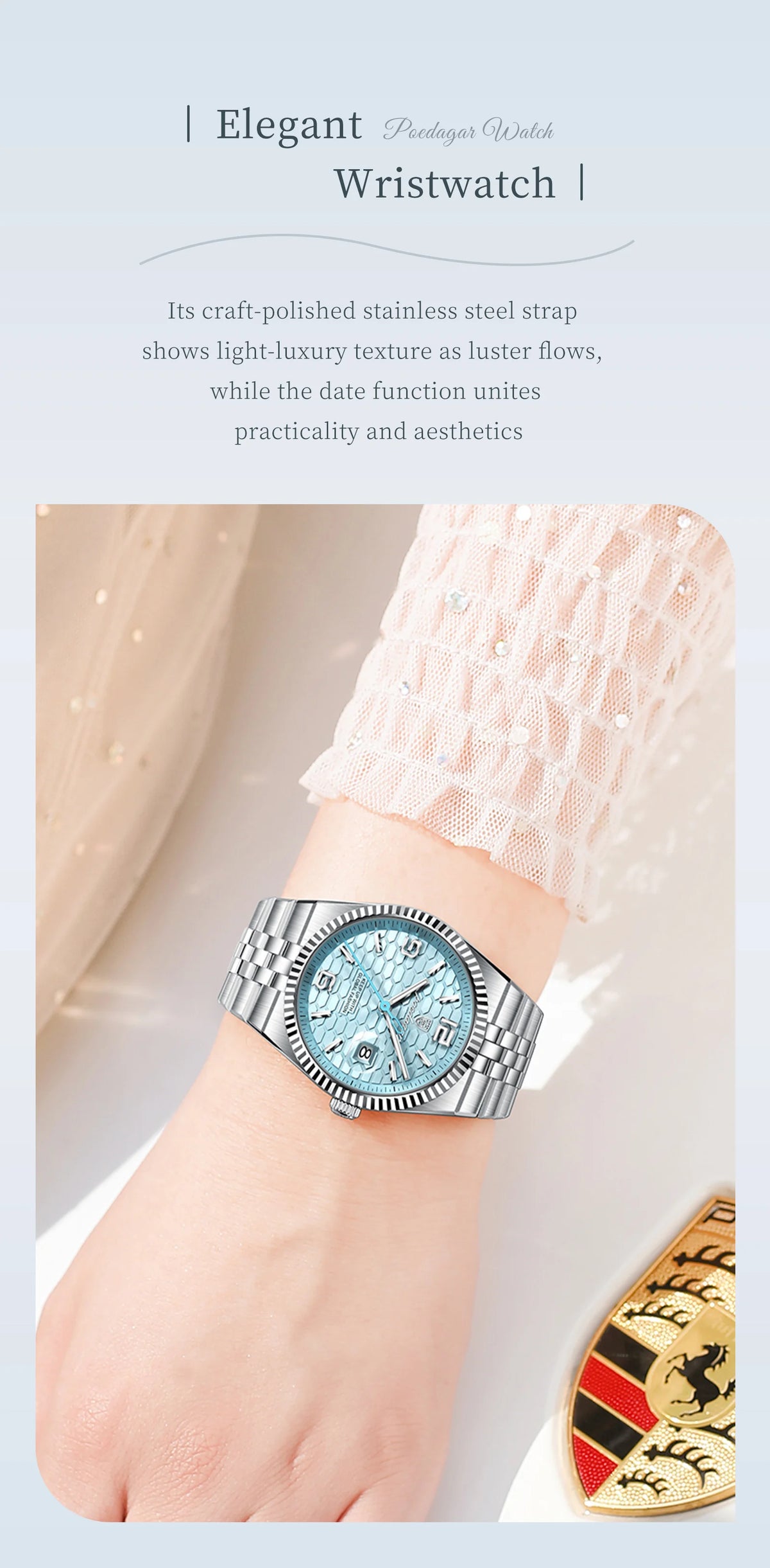 A close-up of an elegant stainless steel wristwatch with a light blue luminous dial and a pink lace cuff on a hand.