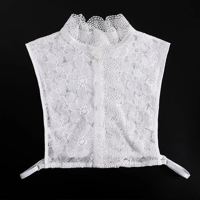 White lace blouse with a ruffled false collar and a sheer overlay