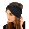 A woman wearing a black bohemian pattern headband on her hair.