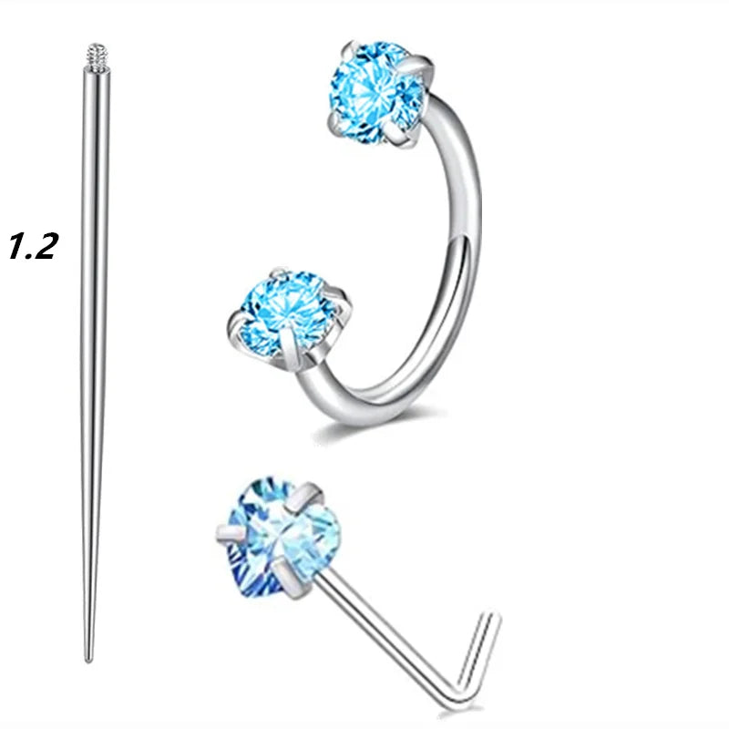 A set of silver horseshoe nose rings featuring round, clear blue cubic zirconia stones.