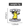 A yellow chicken enamel lapel pin with the text PEW PEW and MADAFAKAS!