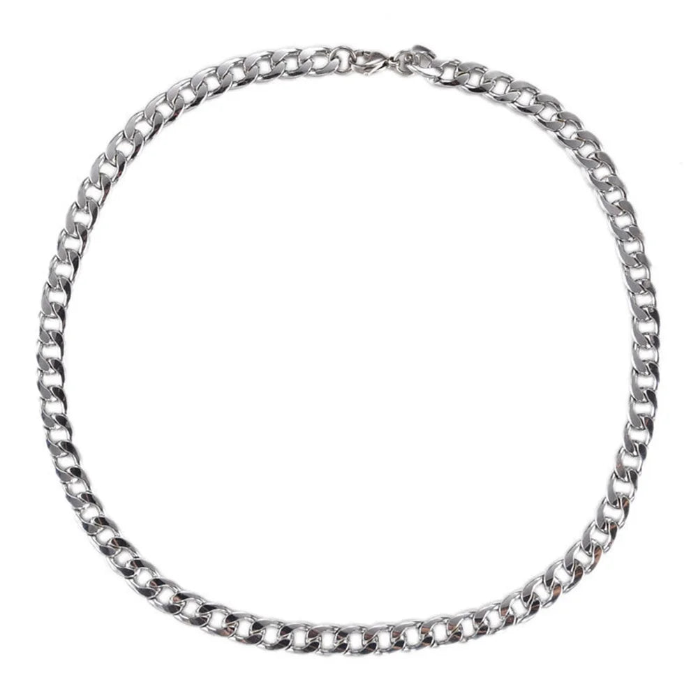 A silver stainless steel hip hop Cuban chain necklace laid out in a circle.