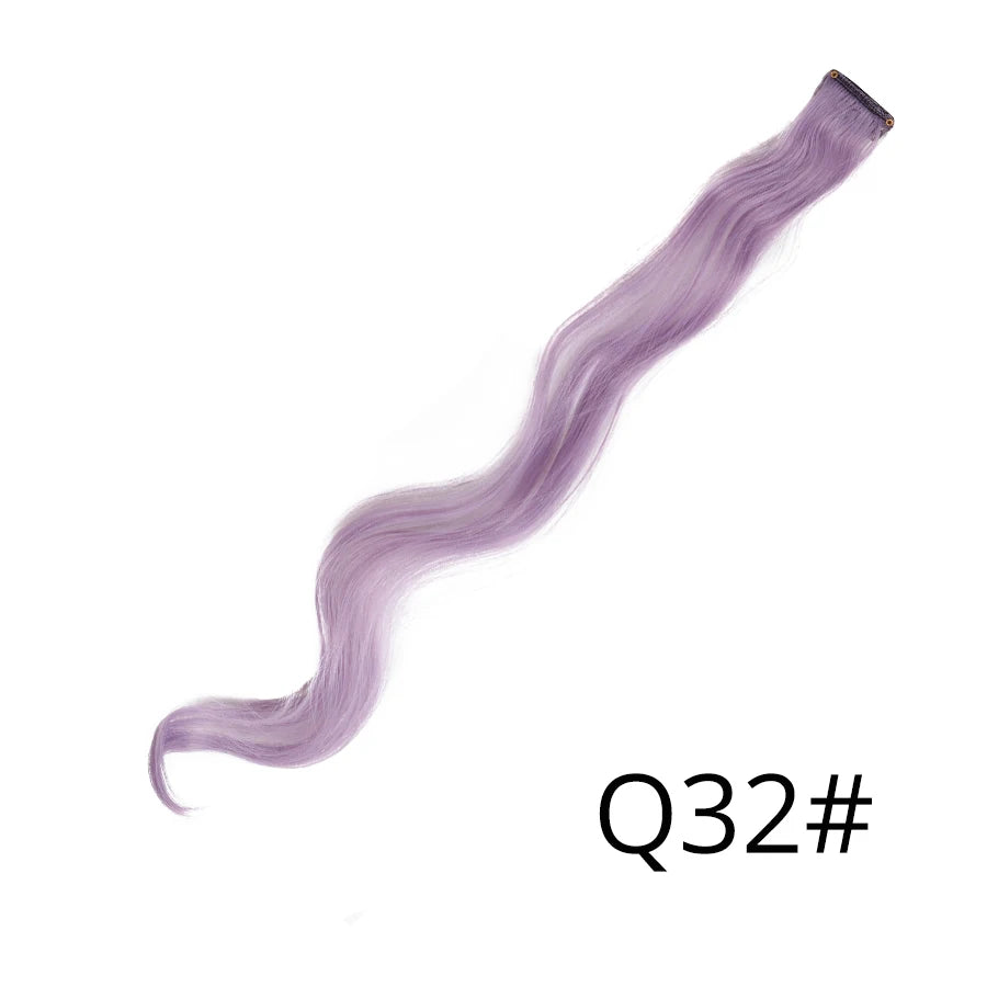 A long, purple synthetic hair extension is shown lying diagonally against a white background.