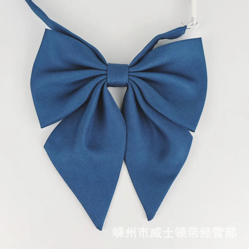 A navy blue butterfly ribbon tie set for students