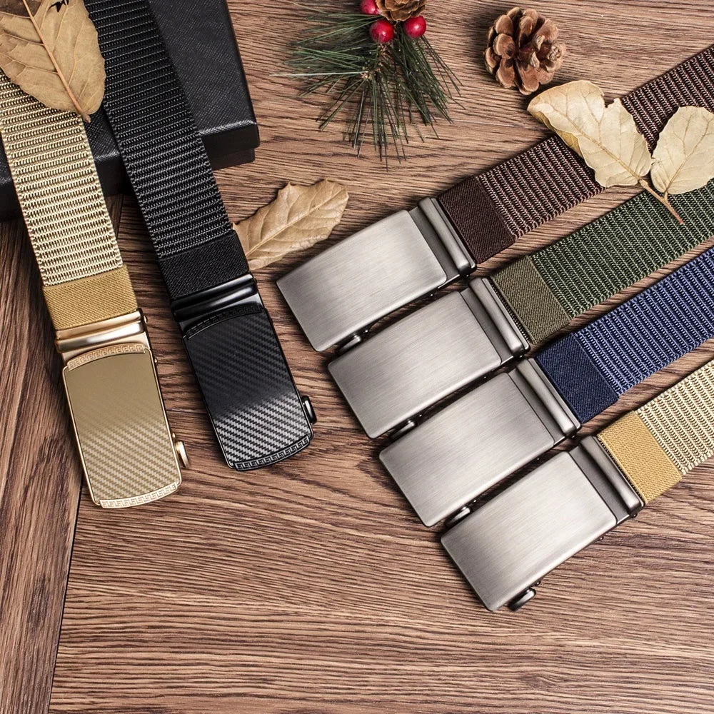 A close-up of a tactical canvas utility belt with various strap colors and metal buckles resting on a wooden surface.