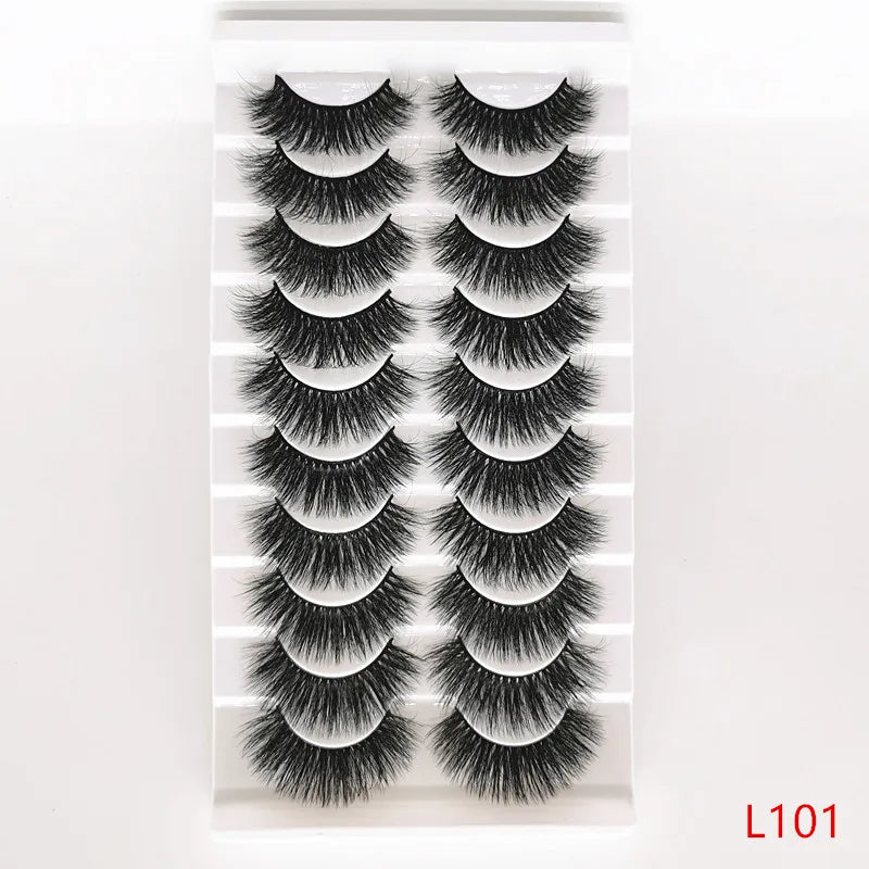 A set of dramatic mink false eyelashes displayed in a clear packaging.