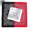 A folded bandana scarf featuring black and red paisley patterns on a white background.