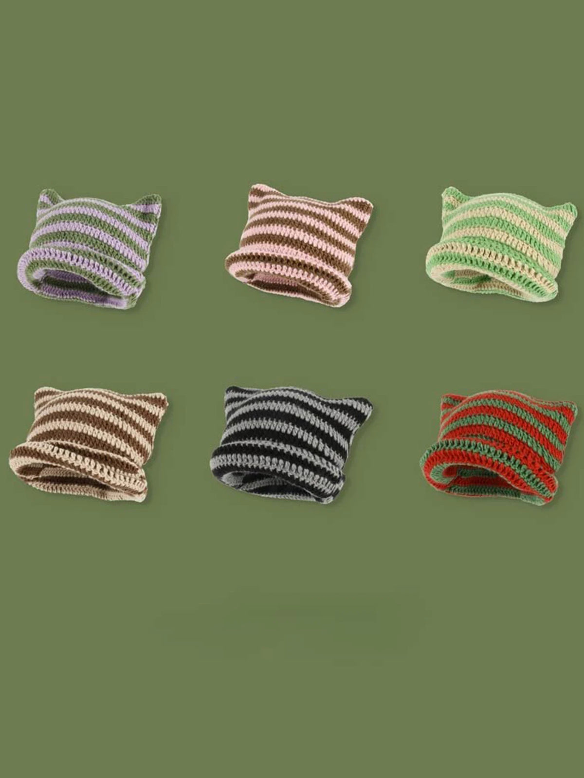 A collection of five crocheted cat ears beanie hats in various striped colors including purple, pink, green, brown, and red.