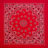 A red fabric featuring an intricate white paisley print design.
