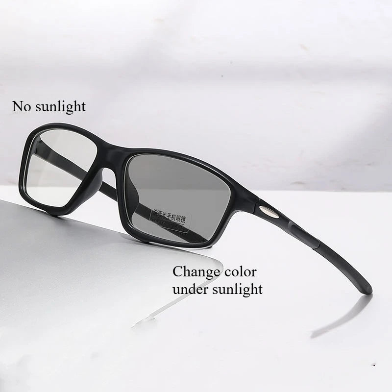 Black photochromic reading glasses shown with text indicating no sunlight and the ability to change color under sunlight.