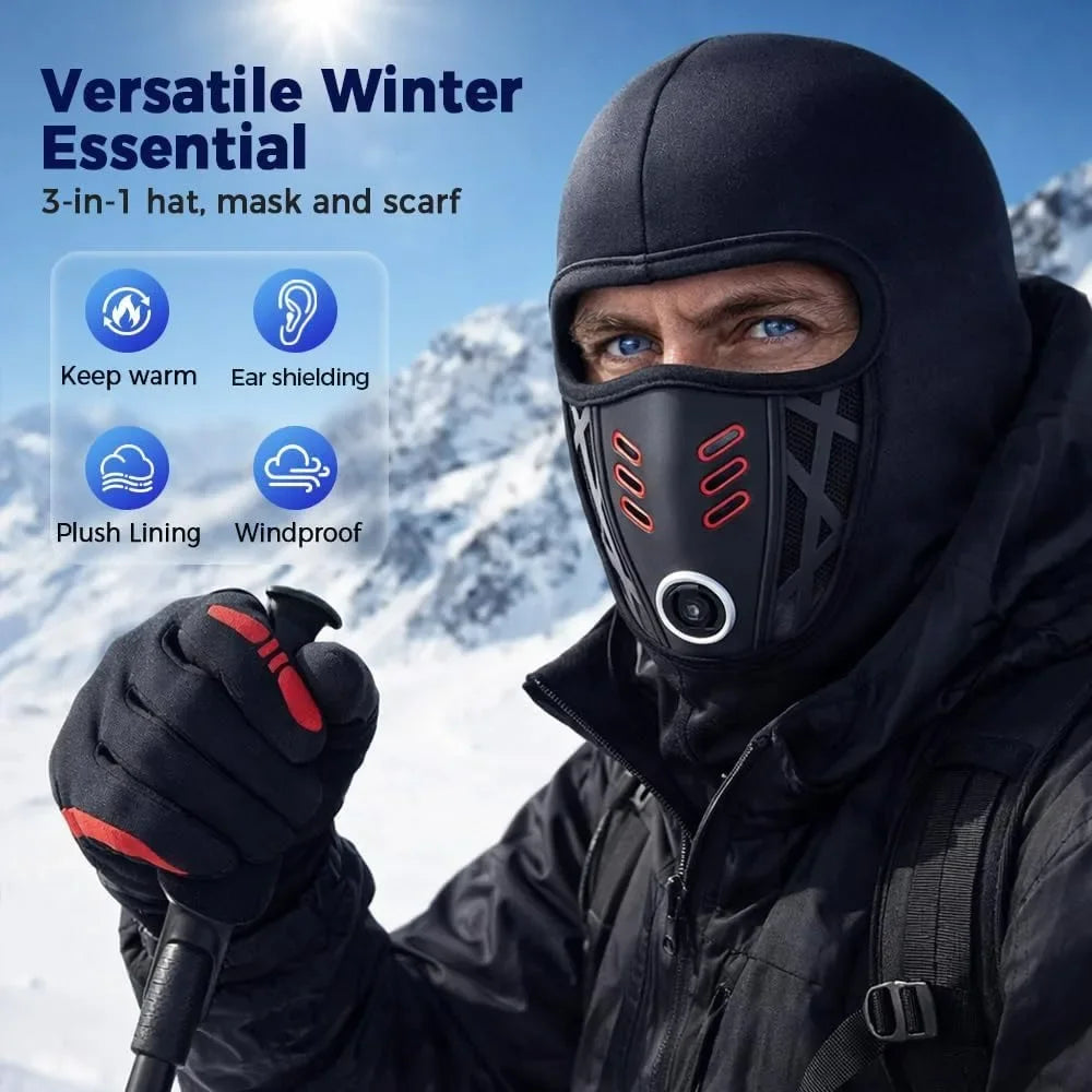 A man wearing a black versatile winter essential balaclava face mask and scarf in a snowy outdoor setting.