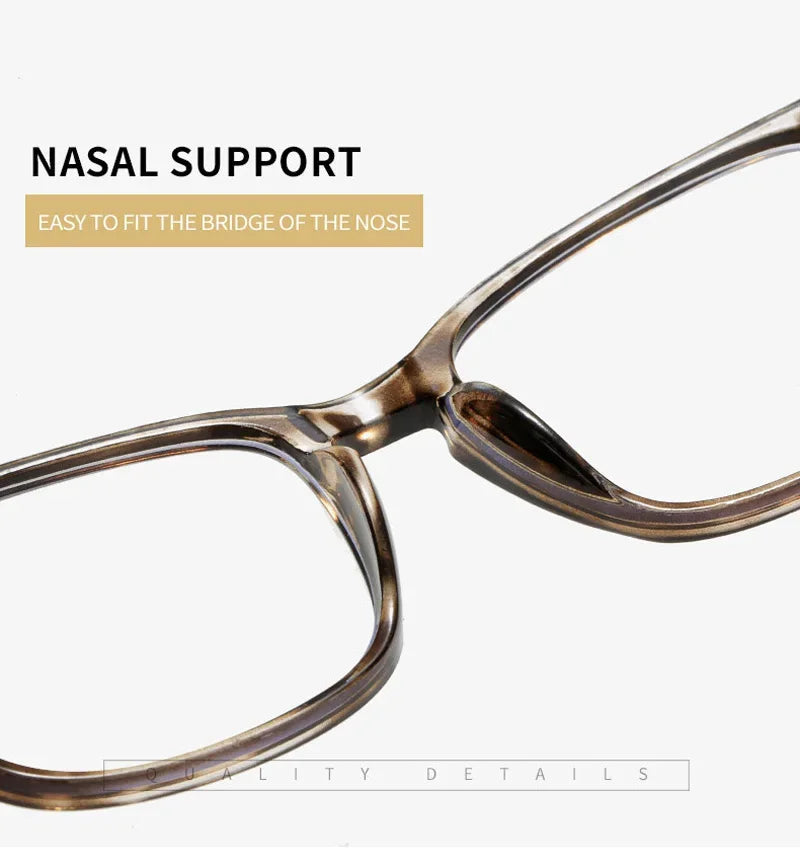 Un par de gafas de lectura de tono marrón con puente nasal en vista de cerca.