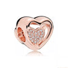 Rose gold heart pendant charm with a clear diamond-like heart design