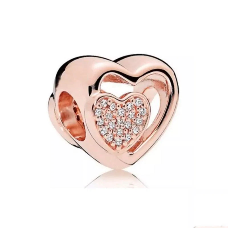 Rose gold heart pendant charm with a clear diamond-like heart design