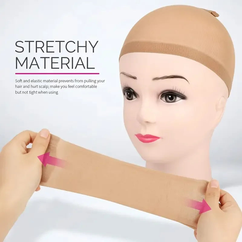 A hand is stretching a tan stretchy material, demonstrating the flexible nature of a non-slip wig cap.
