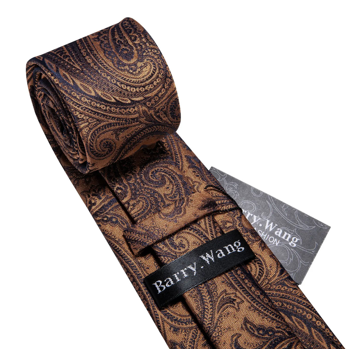 A close-up of a brown patterned silk jacquard tie rolled and displayed next to a name tag.