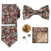 A set of men's formal tie and accessory featuring a patterned tie, bow tie, and pocket square.