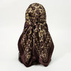 A dark brown silk scarf with a leopard print pattern tied in a knot.