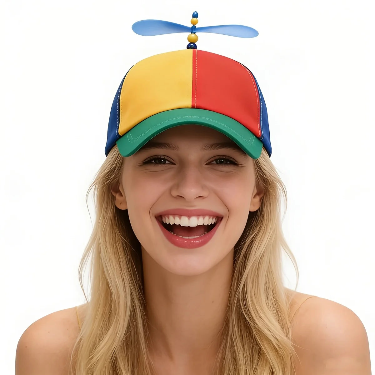 A young woman smiling while wearing a funny multicolor propeller hat.