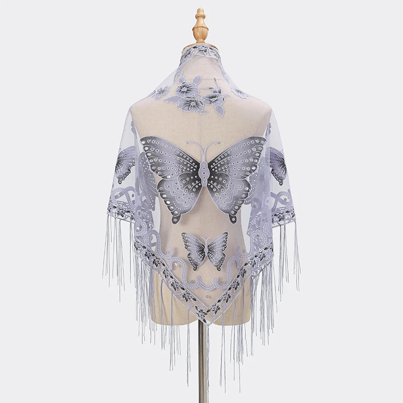 A sheer lilac butterfly lace scarf shawl displayed on a mannequin.