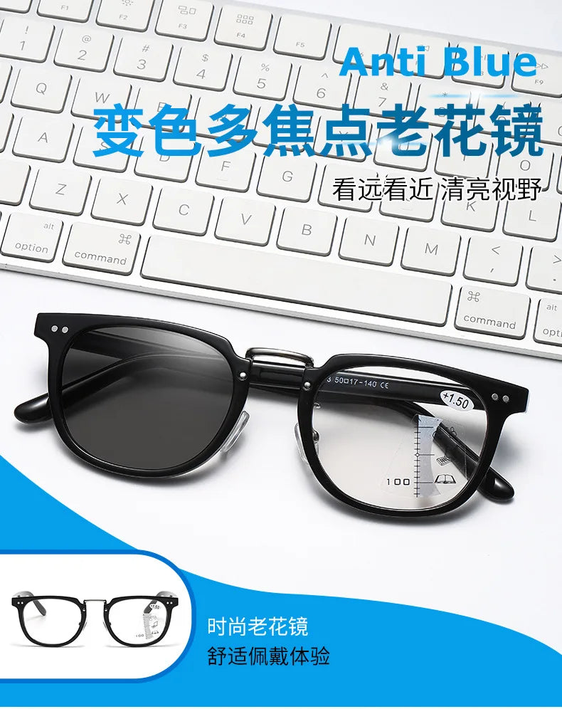 A pair of black reading glasses displayed next to a white laptop keyboard and text promoting anti-blue protection.