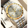 A silver and gold men's watch with a leather strap is shown on a light background.