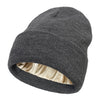 A dark gray satin-lined beanie hat shown from the side.