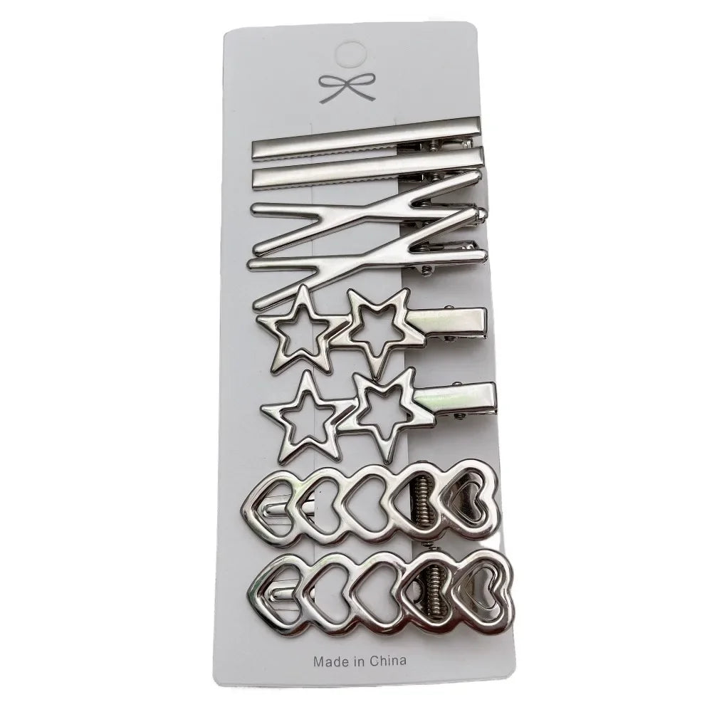 A set of vintage silver Y2K metal hair clips featuring various decorative and geometric designs.