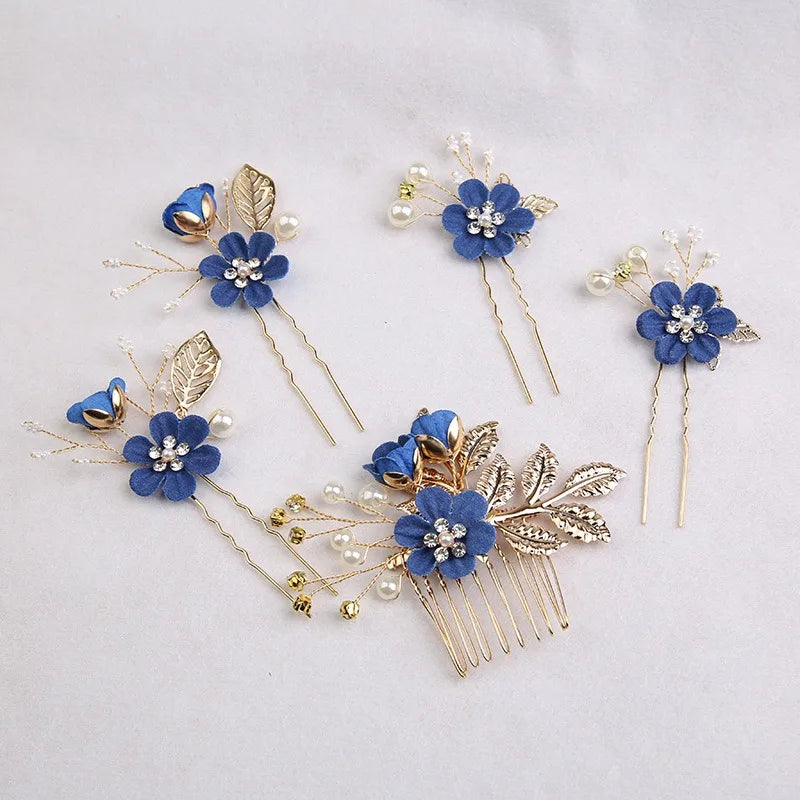 A set of five blue floral pearl bridal hair accessories featuring delicate leaves and gold accents.