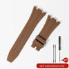 A brown silicone watch band with a textured strap and a metal buckle is shown on a white background.