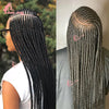 A woman shows off a long black braided cornrow hairstyle with a wig.