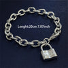 A silver charm lock bracelet made of 925 sterling silver chain with a padlock charm.