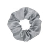 A gray satin scrunchie tied in a voluminous bow shape.