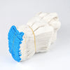 A tightly wound bundle of white cotton thread work gloves with bright blue accents.