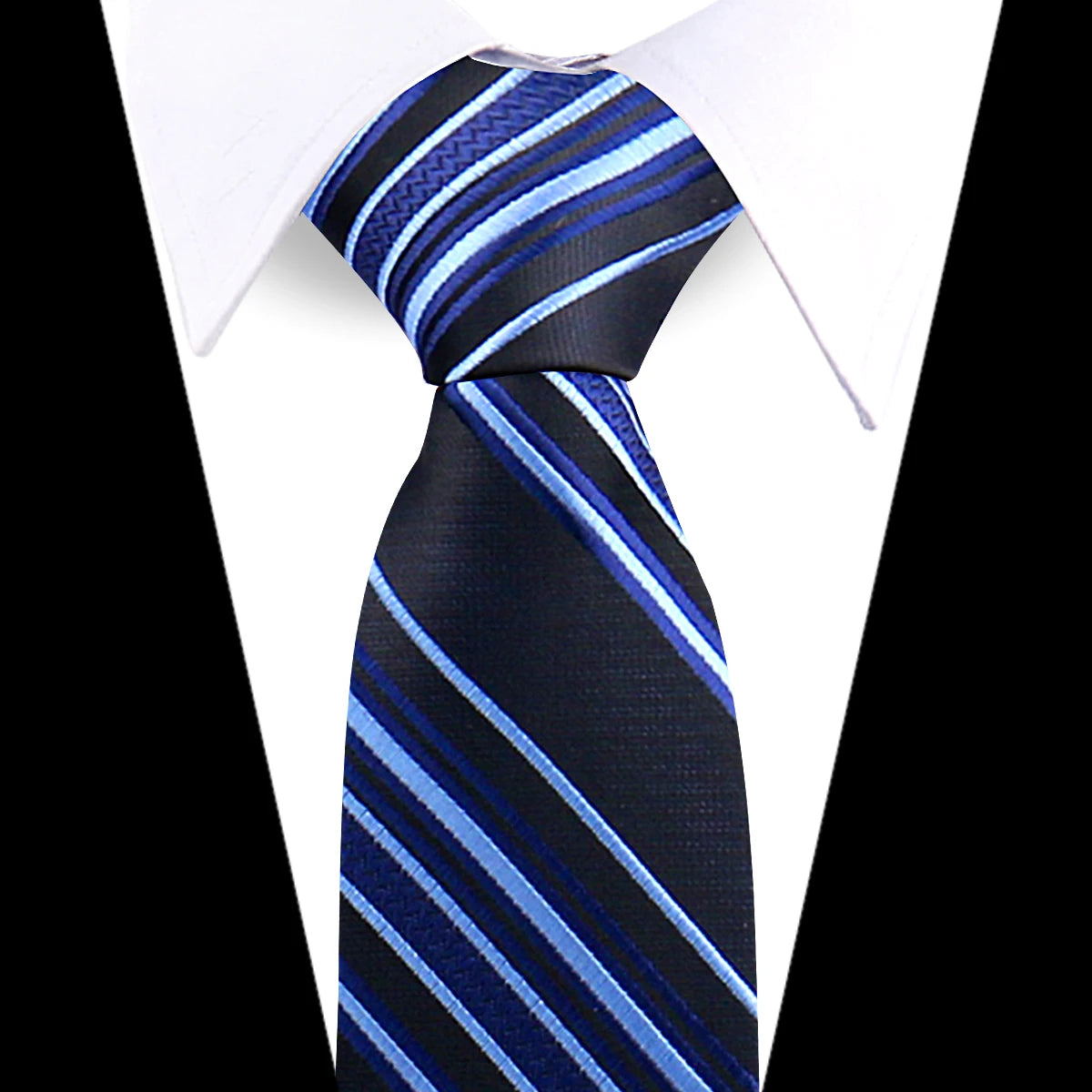 A navy blue and light blue striped silk necktie worn with a white dress shirt.