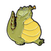 A cute green frog enamel pin with yellow belly and a yellow trumpet.