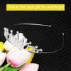 A silver crystal hair crown shaped like a royal princess sits on pink and white tulips.