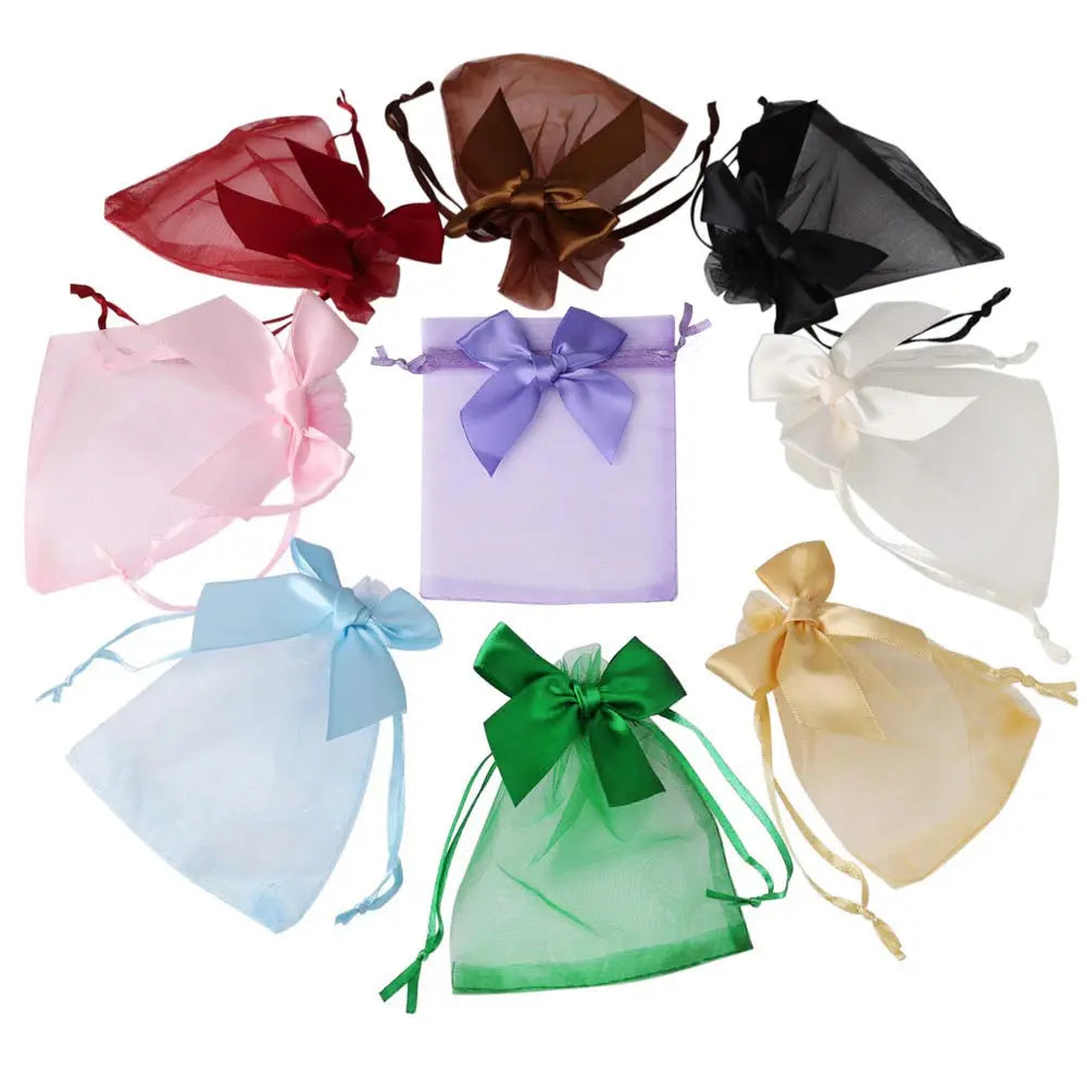 A collection of elegant organza drawstring gift bags in various colors including red, brown, purple, black, white, blue, and 