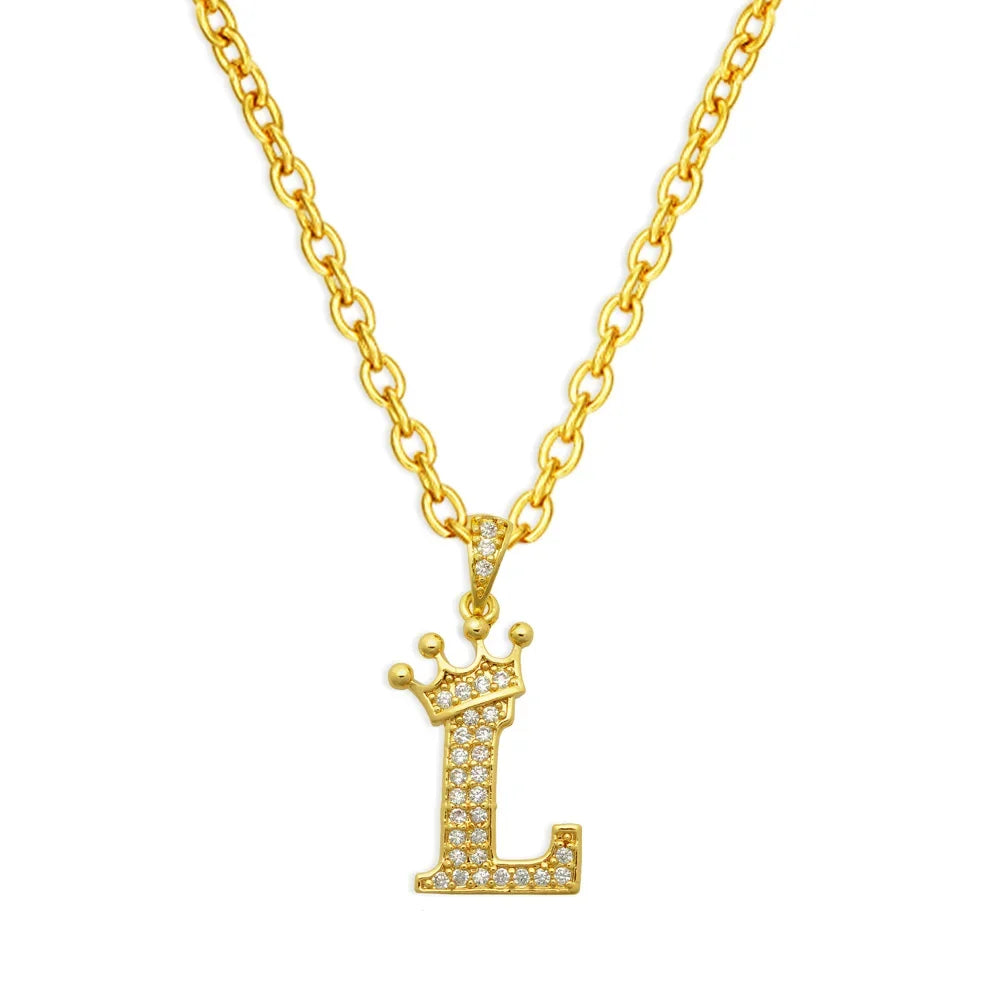 Gold initial L crown pendant necklace with a delicate chain.
