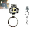 Silver letter E pendant and ring keychain on a black background