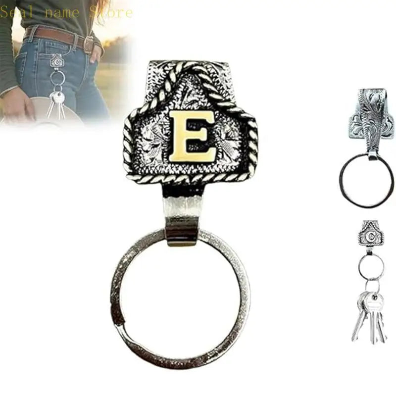 Silver letter E pendant and ring keychain on a black background