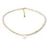 A delicate mother of pearl necklace with crystal accents and a charm.