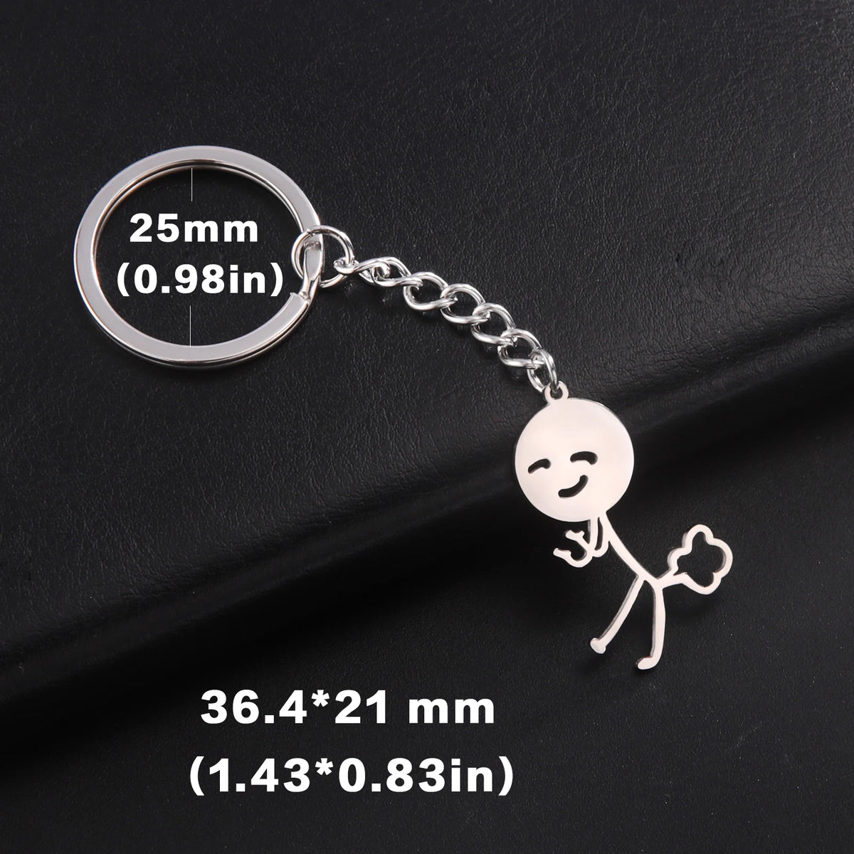 Silver keychain featuring a stickman figure and a circular measurement tag.