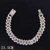 A silver crystal Cuban link anklet featuring a textured chain design.