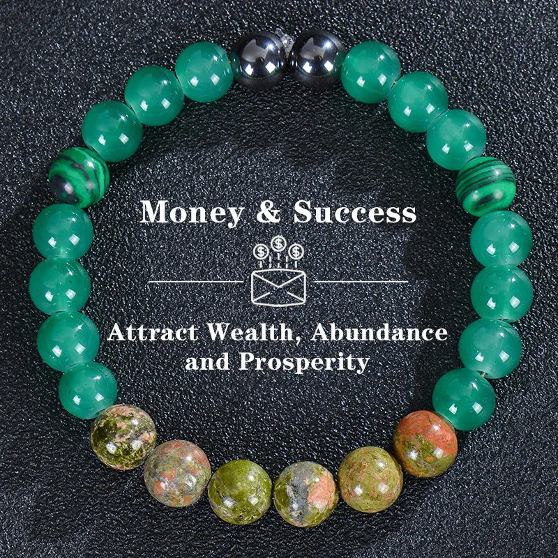 A bracelet made of various green and silver beads, including tiger eye crystals, for attracting wealth and prosperity.