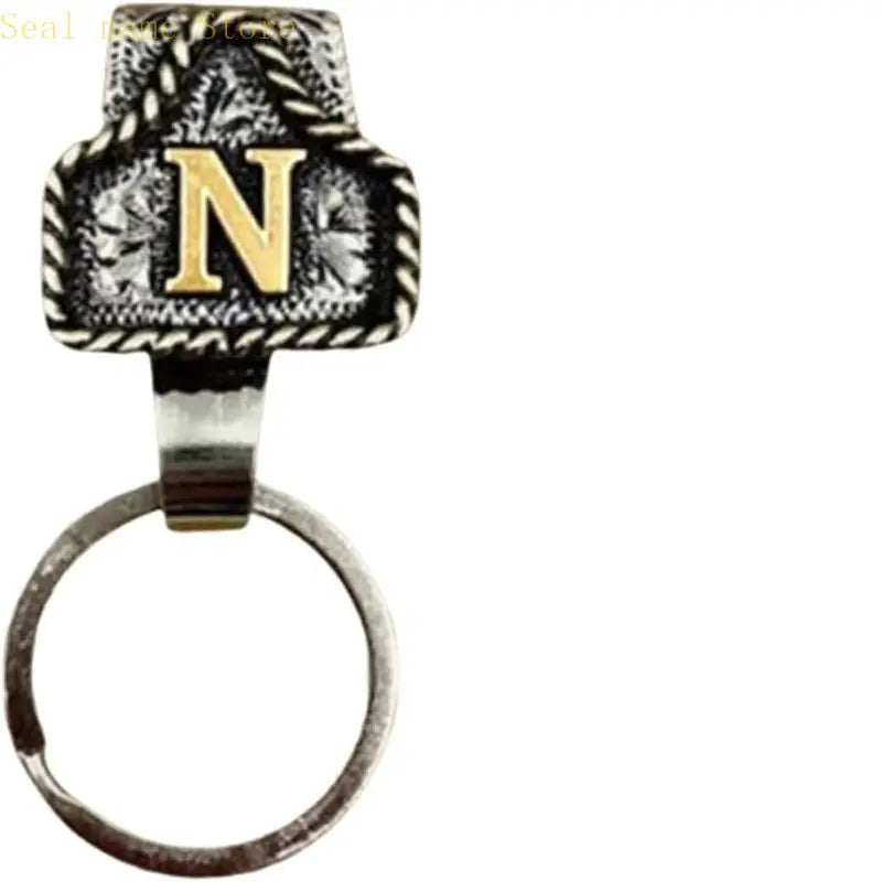 A silver belt keychain featuring a textured black and white letter N design.