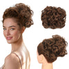 A woman shows off a voluminous brown curly updo hairstyle, featuring a synthetic chignon hairpiece.