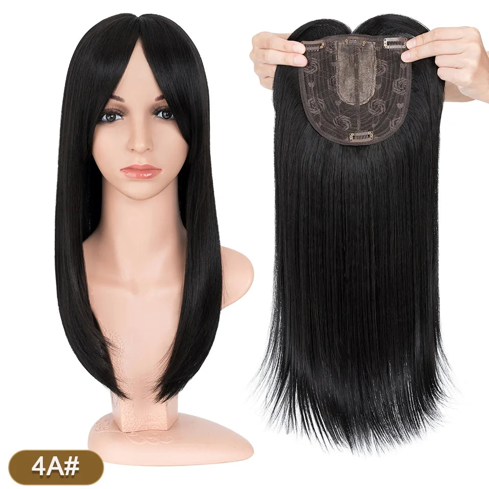 A display of straight black hair toppers with bangs shown on a mannequin head and as a separate bundle.